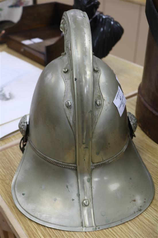 A firemans helmet and a leather belt